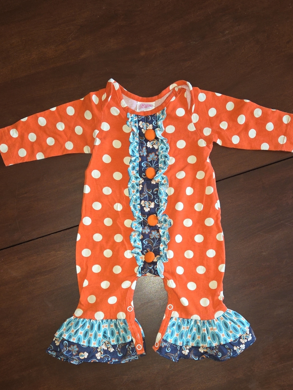 Girls Orange Polka Dot Ruffle One-Piece Bodysuit with Blue Floral Trim